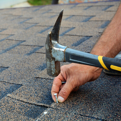 nailing down roofing shingles